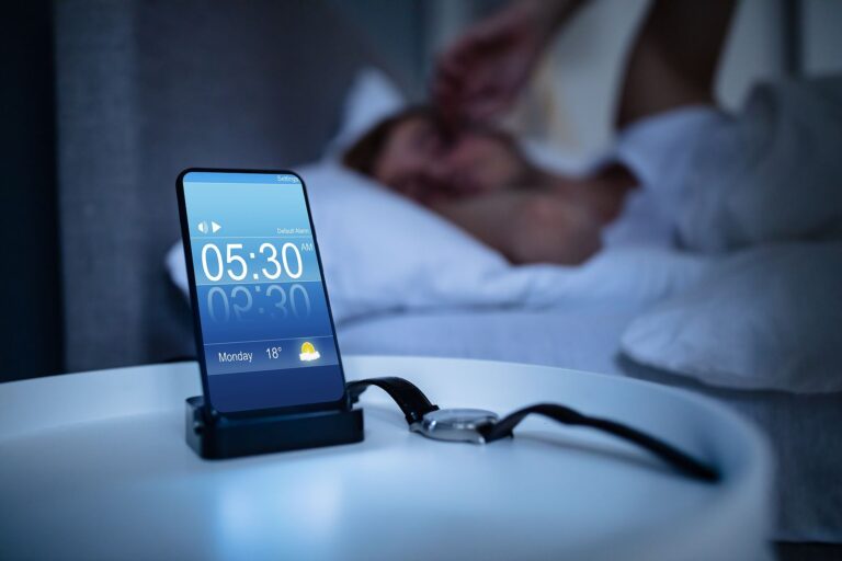 bigstock man waking up with alarm on mo 321850537