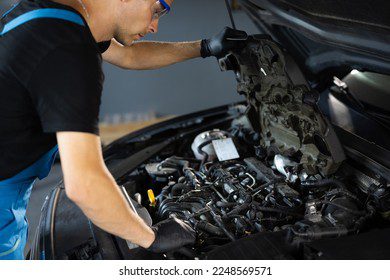 car mechanic noting repair parts 260nw 2248569571