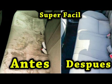 Manos limpiando asiento de tela del coche