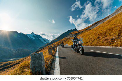 motorcycle driver riding alpine highway 260nw 708934741